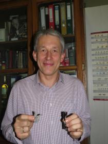  SINP scientist Alexander Chepurnov with the samples of Titanium with l...